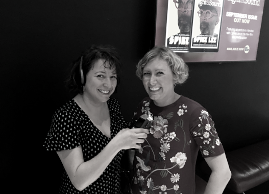 Lena Nahlous holding a microphone up to Jennifer Smith, Head of Inclusion at British Film Institute (BFI)